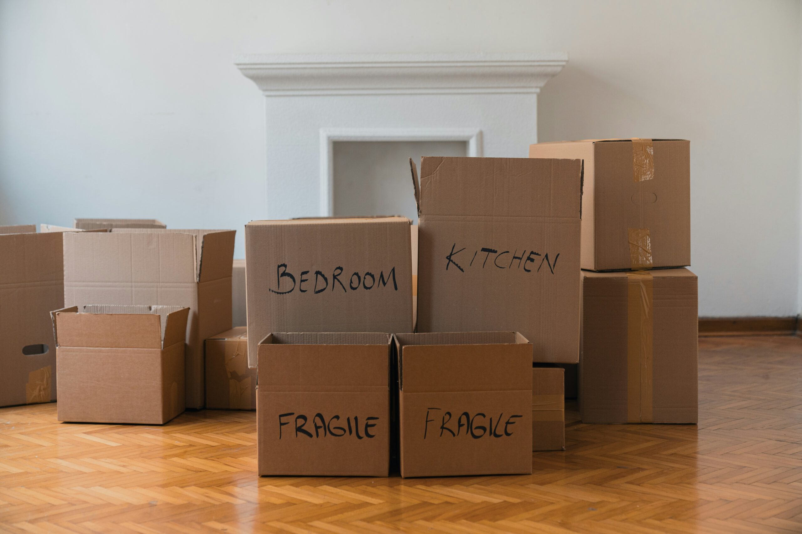 cardboard boxes labelled for packing